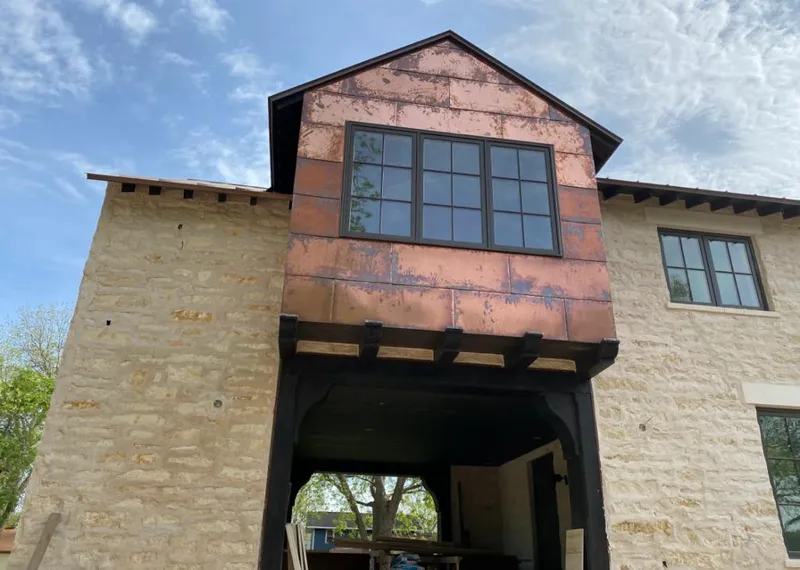 Copper metal panel facade on a stone building for Skylight Installation in Auburn Hills